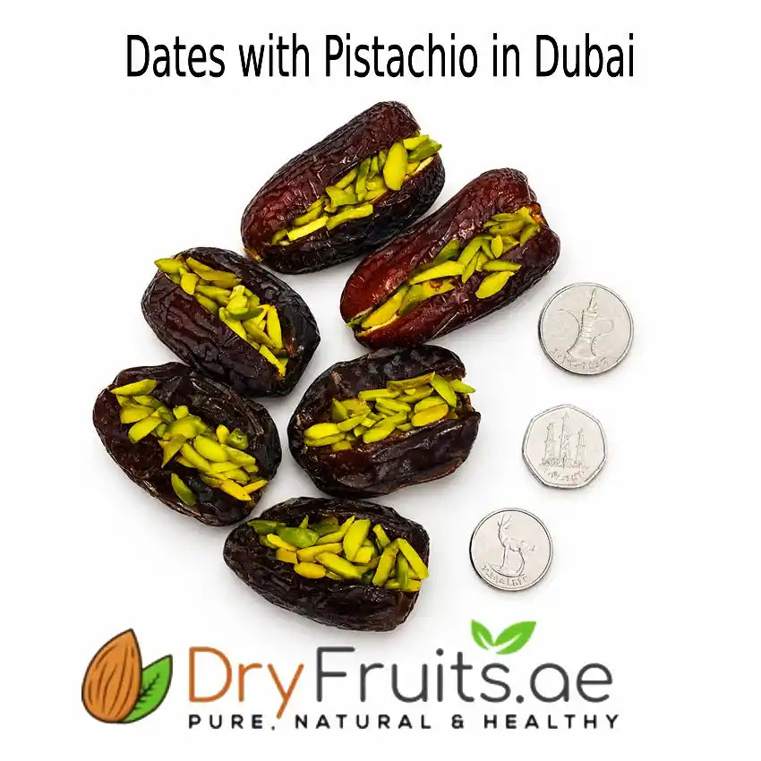 Dates with pistachio pieces next to coins on a white background with DryFruits.ae branding.